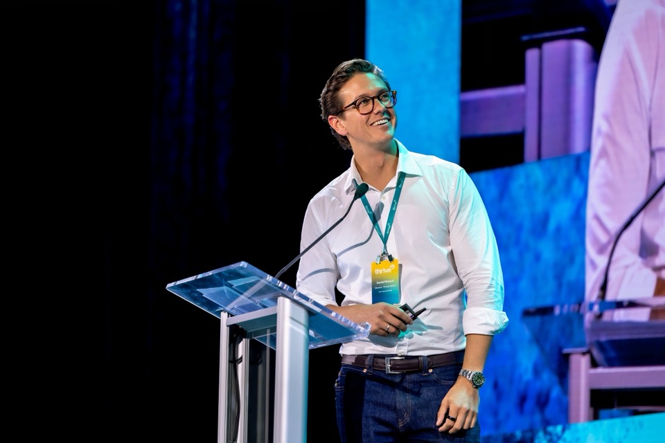 Daniel Rickard speaking with an audience member